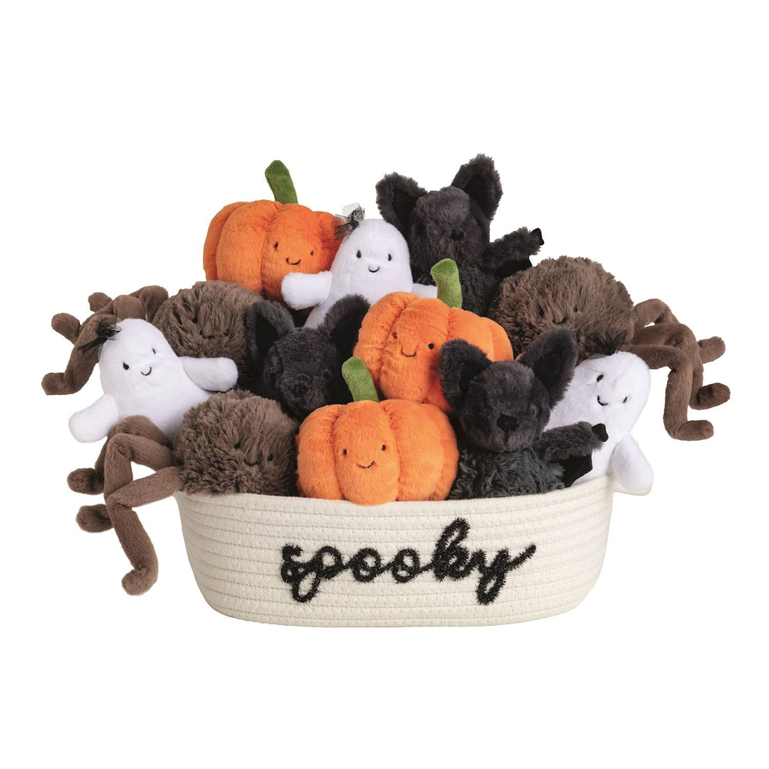 Halloween-themed plush toys including pumpkins, ghosts, and spiders in a basket labeled 'spooky'.