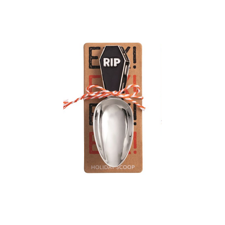 Metal scoop with decorative packaging featuring a coffin and 'RIP' text on a black background.