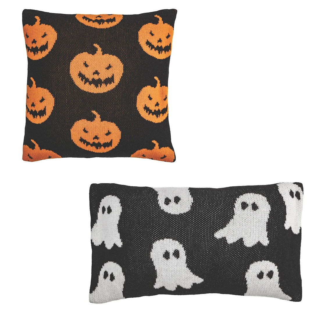 Two square knit pillows, one with a jack-o-lantern design and the other featuring ghosts, indicative of Halloween decor.