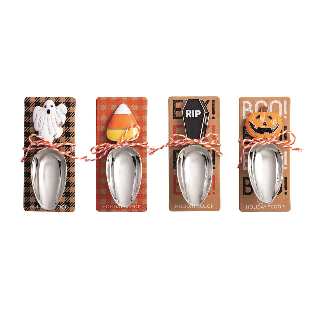 Four Halloween-themed spoons on their respective packaging with ghost, candy corn, coffin, and jack-o'-lantern designs.