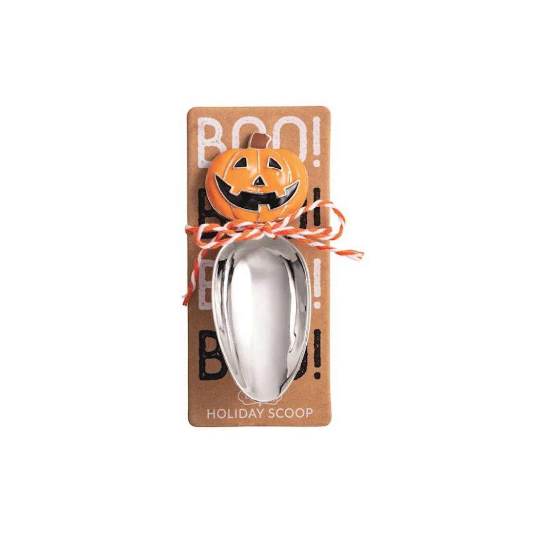 Halloween-themed metal scoop with packaging featuring a jack-o'-lantern design.