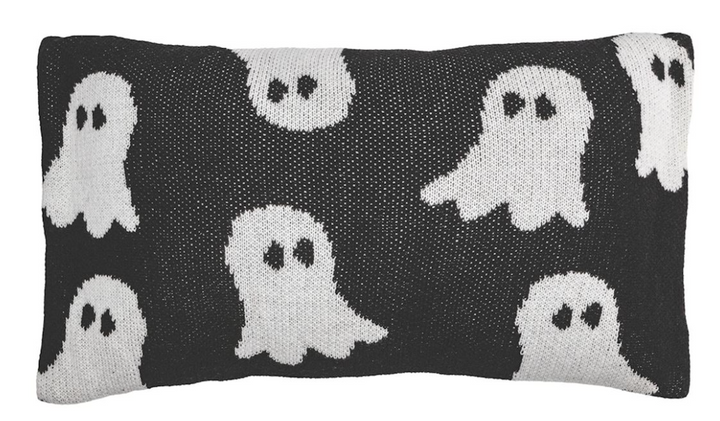 Lumbar knit pillow, featuring ghosts, indicative of Halloween decor.