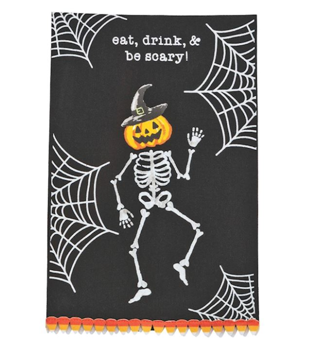 Halloween-themed towels with a dancing skeleton and spider webs. Text reads: eat, drink & be scary!