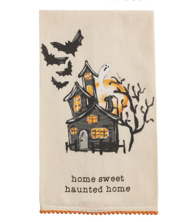 Halloween-themed towel with a haunted house. Text reads: home sweet haunted home