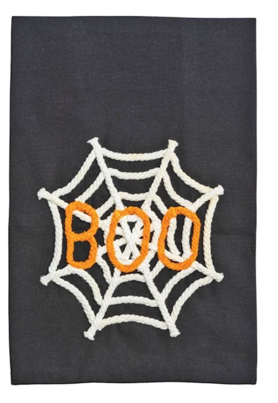 Black towel with a white spider web and orange 'BOO' text on a dark background