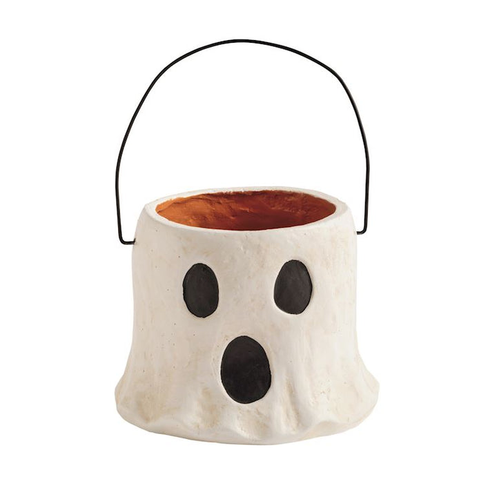 Paper mache ghost-shaped container with a black handle on a white background