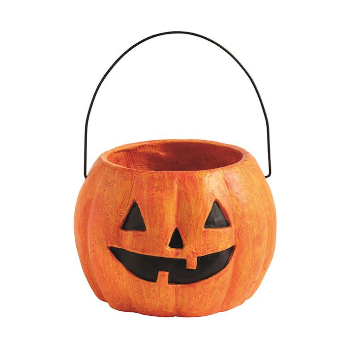 Pumpkin-shaped Halloween candy bucket with a black handle on a white background
