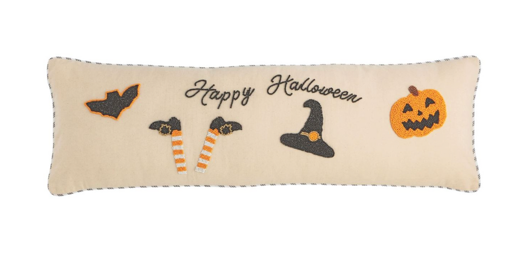 Decorative pillow with Halloween-themed designs on a white background